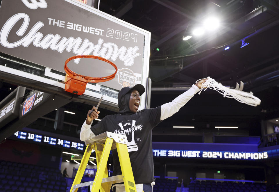 UC Irvine's Diaba Konate cheers in a net-cutting ceremony after their team won against UC Davis in an NCAA college basketball game in the championship of the Big West Conference women's tournament Saturday, March 16, 2024, in Henderson, Nev. (AP Photo/Ronda Churchill)