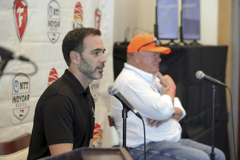 Jimmie Johnson, left, speaks about joining the team of Chip Ganassi, right, for the IndyCar series at a press conference during the IndyCar race weekend Saturday, Oct. 24, 2020, in St. Petersburg, Fla. (AP Photo/Mike Carlson)