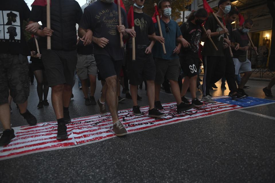 Protesters take part in a rally against the visit of the U.S. Secretary of State Mike Pompeo in Greece, in the northern city of Thessaloniki, on Monday, Sept. 28, 2020. Pompeo said Monday that Washington will use its diplomatic and military influence in the region to try to ease a volatile dispute between NATO allies Greece and Turkey over energy rights in the eastern Mediterranean. (AP Photo/Giannis Papanikos)