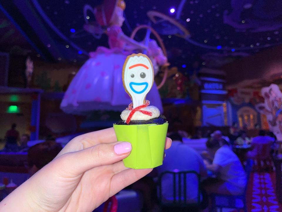 hand holding up a forky cupcake at roundup rodeo bbq in hollywood studios