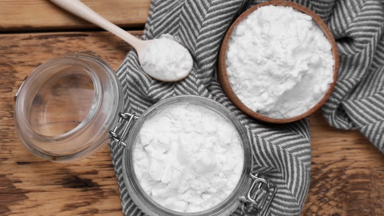 Two small bowls of white powdered starch with a spoon