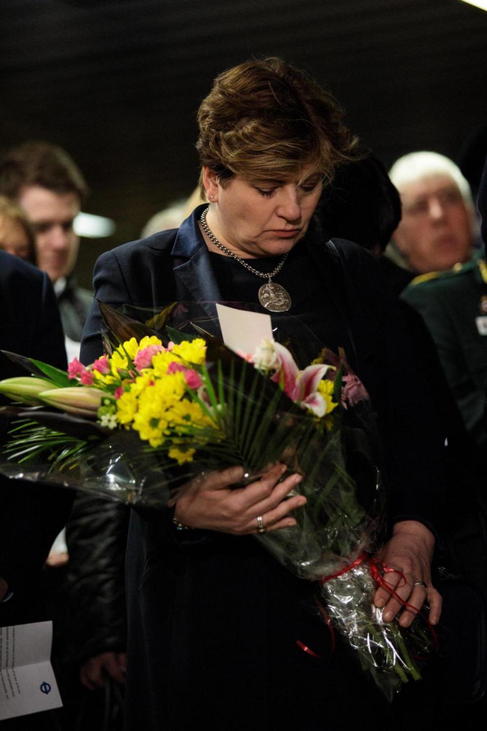 Labour's Emily Thornberry lays flowers during the memorial service (Getty Images)