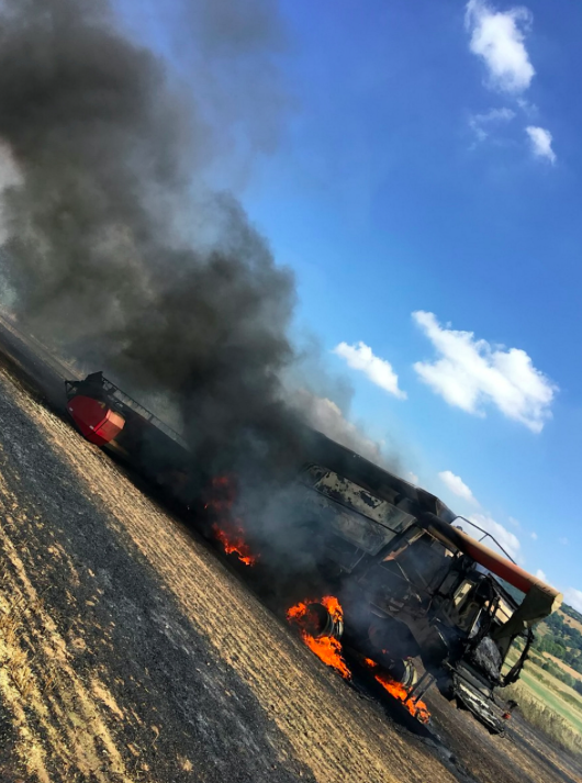 <em>Two combine harvesters went up in smokes as farmers struggled to tend to their crops in the heat (SWNS)</em>