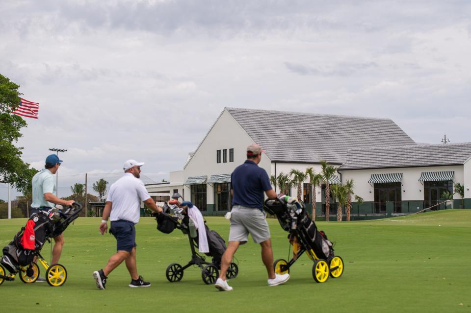 A trio of golfers walk towards the clubhouse at The Park West Palm Beach during the grand opening of the new public golf course in April. A national strategy to combat loneliness and increase connectedness includes making more public spaces available.