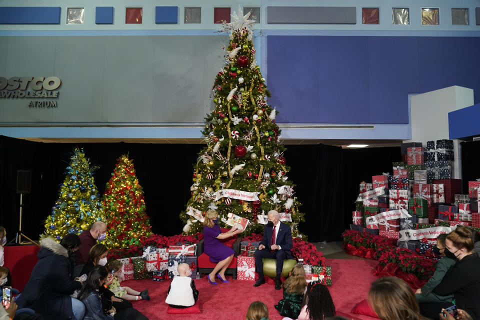 First lady Jill Biden, accompanied by President Joe Biden, reads "The Snowy Day" by Ezra Jack Keats at Children's National Hospital in Washington, Friday, Dec. 23, 2022. (AP Photo/Andrew Harnik)