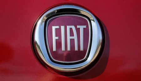 The Fiat logo is seen on a Fiat vehicle displayed outside Chrysler World Headquarters during the FCA Investors Day in Auburn Hills, Michigan May 6, 2014. REUTERS/Rebecca Cook