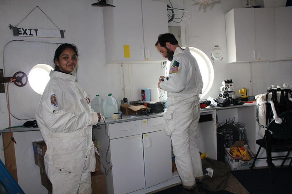 Mars 160 crewmembers Anushree Srivastava and Paul Knightly prepare for an extravehicular activity. <cite>The Mars Society</cite>