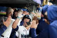 Seattle Mariners' Ty France celebrates his two-run home run in the dugout against the Kansas City Royals during the eighth inning of a baseball game Monday, May 13, 2024, in Seattle. (AP Photo/Lindsey Wasson)