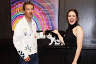 <p>Benedict Cumberbatch and Claire Foy pose with one of their furry costars at the screening of <em>The Electrical Life of Louis Wain</em> in London on Oct. 10.</p>