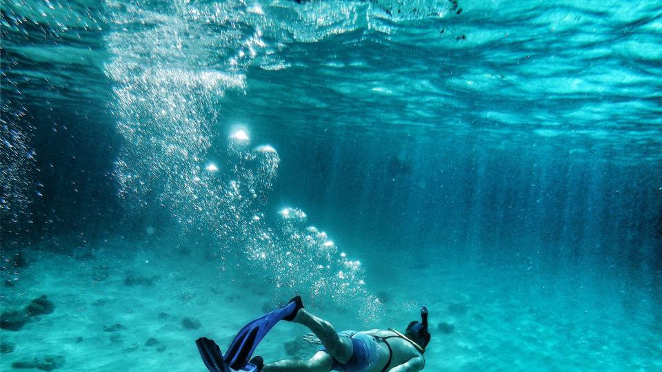 young man swimming in sea