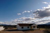 The abandoned house of Rhonita Miller, who was killed along with four of her children by unknown assailants, is seen in La Mora