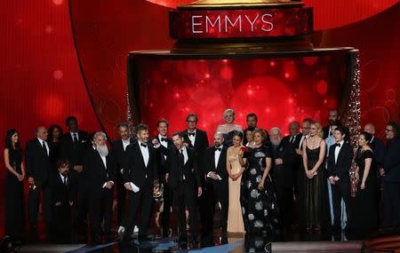 Executive Producers David Benioff, center left, and D.B. Weiss accept the award for Oustanding Drama Series for "Game of Thrones" with the cast and crew at the 68th Primetime Emmy Awards in Los Angeles, California, U.S., September 18, 2016. REUTERS/Mike Blake