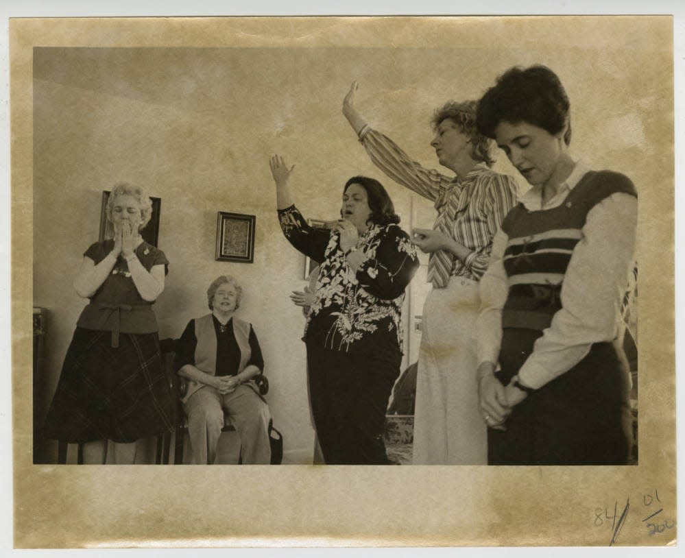 Group of women speaking in tongues during a meeting of their prayer group in 1981.