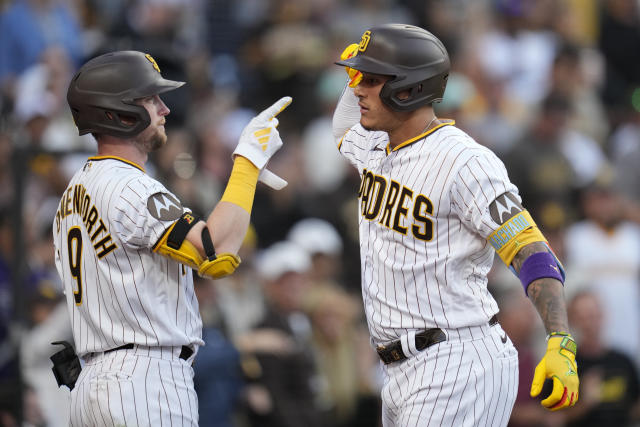 Manny Machado of the San Diego Padres and teammates celebrate with