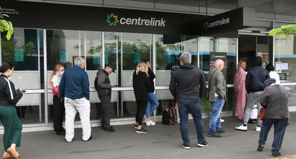 People lining up outside Centrelink. 