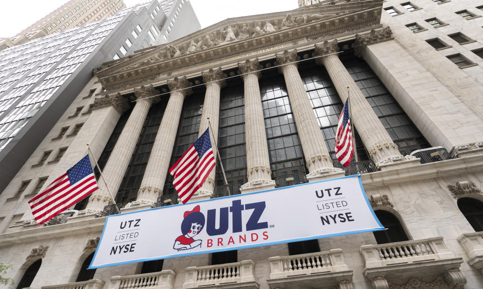 A banner for Utz Brands, which is listed at the New York Stock Exchange, hangs on the exterior of the building, Monday, Aug. 31, 2020, in New York. The Hanover, Pa. based company is known for its potato chips and snack foods. (AP Photo/Mark Lennihan)