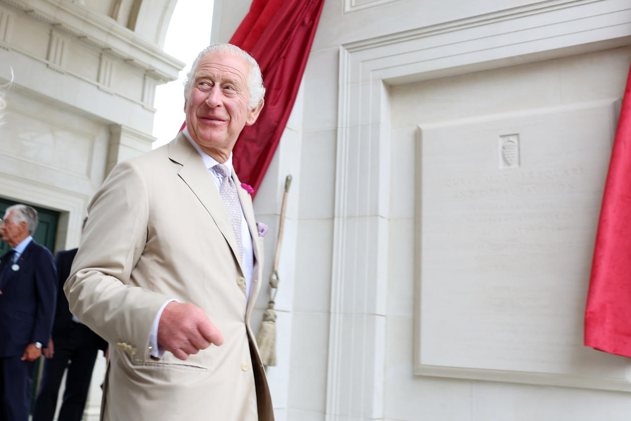 DORCHESTER, DORSET - JUNE 27: King Charles III reacts after he  and Queen Camilla unveil the plague for the Queen Mother Square and Royal Pavillion as they visit Poundbury at Poundbury on June 27, 2023 in Dorchester, Dorset. The King and Queen are visiting the The Duchy of Cornwall's Poundbury development to view a new bronze relief and to open The Duke of Edinburgh Garden. (Photo by Chris Jackson/Getty Images)