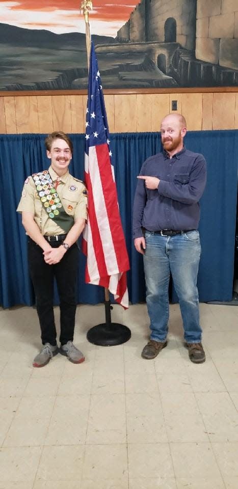 Ian Perry and his scoutmaster, Dan Perkins. Perry was one of four local scouts named Eagle Scouts recently. Ian Perry replaced benches at Sky Lake Camp and Retreat Center for his community service project.