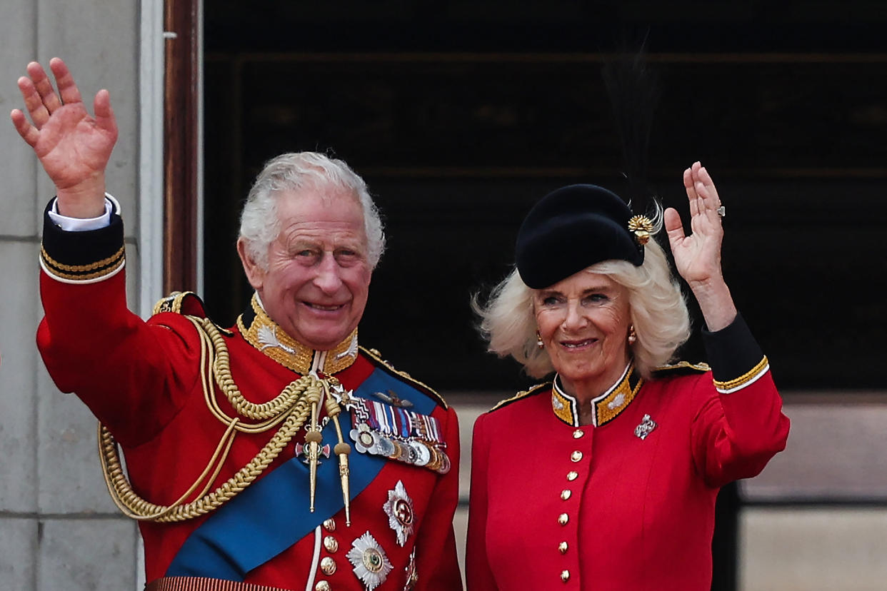 Britain's King Charles III and Britain's Queen Camilla wave from the balcony of Buckingham Palace after attending the King's Birthday Parade, 'Trooping the Colour', in London on June 17, 2023. The ceremony of Trooping the Colour is believed to have first been performed during the reign of King Charles II. Since 1748, the Trooping of the Colour has marked the official birthday of the British Sovereign. Over 1500 parading soldiers and almost 300 horses take part in the event. (Photo by Adrian DENNIS / AFP) (Photo by ADRIAN DENNIS/AFP via Getty Images)