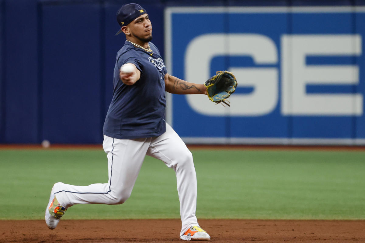 Tampa Bay Rays Evan Longoria removes his batting gear after