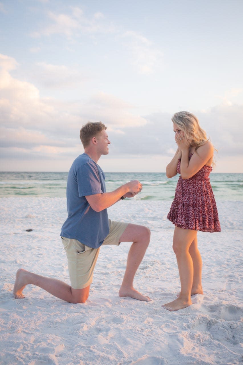 Sadler Snyder propses to Bonnie Hensley in Seaside, Florida on Labor Day weekend of 2021.