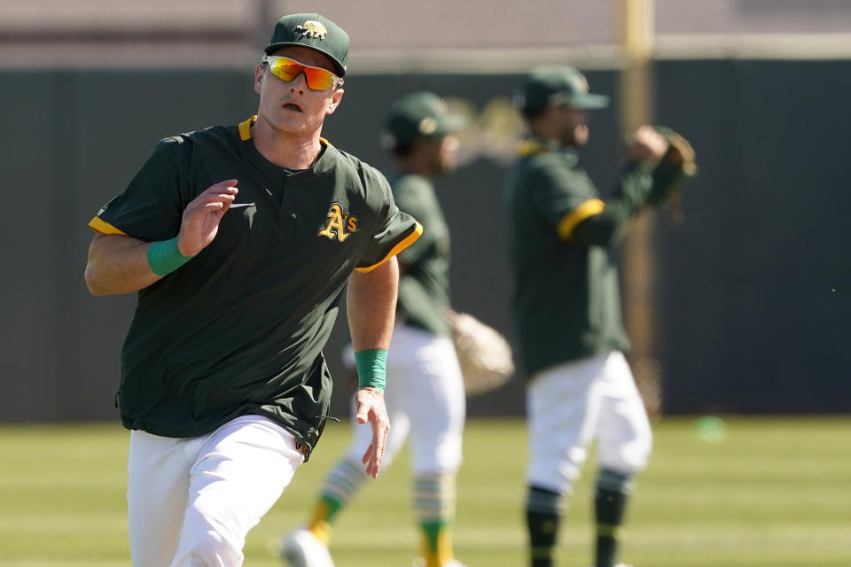 Oakland Athletics' Matt Chapman runs during a spring training baseball practice, Monday, Feb. 22, 2021, in Mesa, Ariz. (AP Photo/Matt York)