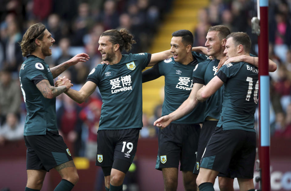 Burnley's Chris Wood, second right, celebrates scoring his side's second goal of the game against Aston Villa during their English Premier League soccer match at Villa Park in Birmingham, England, Saturday, Sept. 28, 2019. (Nick Potts/PA via AP)
