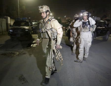 Members of Afghan Crisis Response Unit (CRU) arrive at the site of a Taliban attack in the Afghan capital of Kabul, Afghanistan December 11, 2015. REUTERS/Omar Sobhani