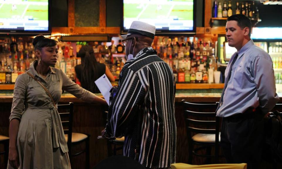 Shontel Brown speaks with Chris Arnett at a Meet and Greet campaign event at Mitchell’s Ultra Lounge in Euclid, Ohio.