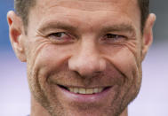 Leverkusen's head coach Xabi Alonso smiles during an interview ahead of the German Bundesliga Soccer match between Eintracht Frankfurt and Bayer Leverkusen in Frankfurt, Germany, Sunday, May 5, 2024. (AP Photo/Michael Probst)