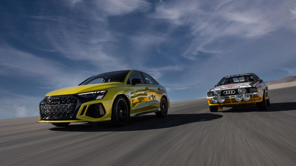 A Python Yellow RS 3 with the 1984 Audi Rallye Quattro A2 racer on its heels. - Credit: Audi AG