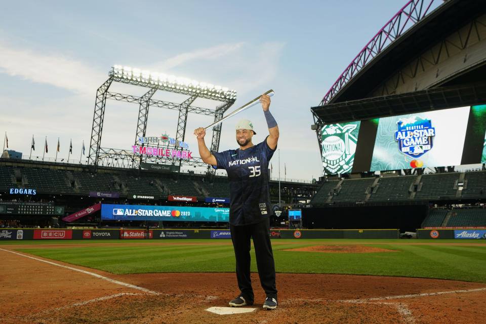 National League's Elias Díaz, of the Colorado Rockies, holds up his MVP trophy after the National League defeated the American League 3-2 in the MLB All-Star baseball game in Seattle, Tuesday, July 11, 2023. (AP Photo/Lindsey Wasson)