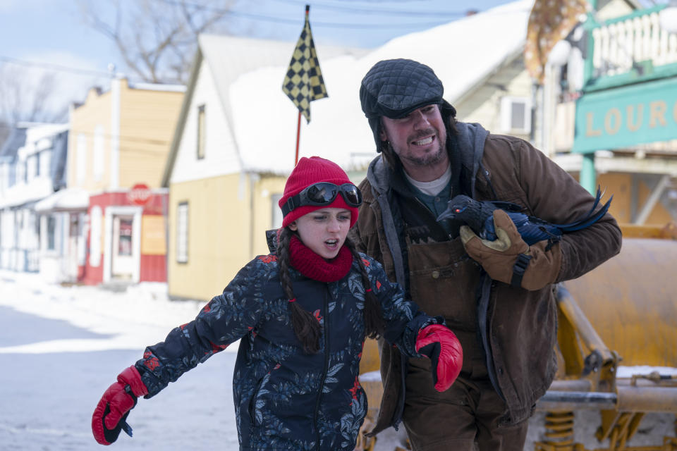 This image released by Paramount+ shows Michaela Russell, left, and Jerry Trainor in a scene from "Snow Day," airing Friday, Dec. 16 on Paramount+ and Nickelodeon. (Phillipe Bosse/Paramount+ via AP)