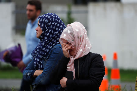 People gather to pay respects after Friday's shooting, outside the Masjid Al Noor in Christchurch, New Zealand March 18, 2019. REUTERS/Jorge Silva