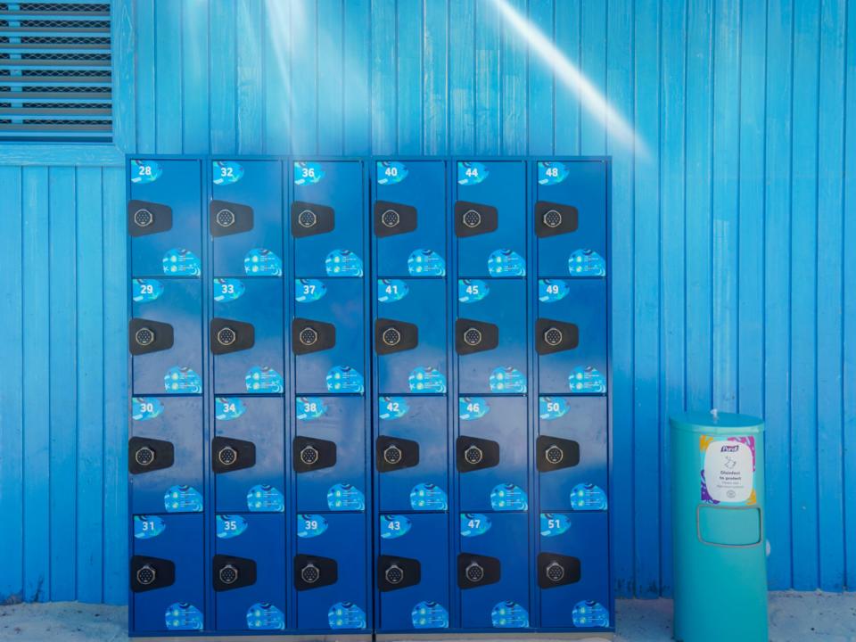 Blue lockers in front of a blue building at CocoCay