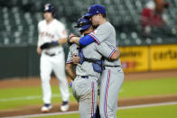 Texas Rangers starting pitcher Kyle Gibson, right, hugs catcher Jeff Mathis after a baseball game against the Houston Astros Wednesday, Sept. 16, 2020, in Houston. The Rangers won 1-0. (AP Photo/David J. Phillip)