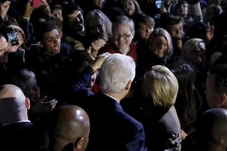 Former U.S. President Bill Clinton (center L) and his wife Democratic U.S. presidential candidate Hillary Clinton greet supporters after she spoke at a rally at an outdoor plaza in Columbia, South Carolina February 26, 2016. REUTERS/Jonathan Ernst