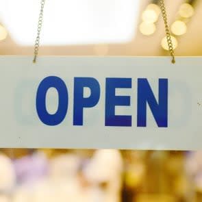 open sign in a window for thanksgiving