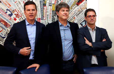 FILE PHOTO: Three victims of clerical sexual abuse in Chile, Juan Carlos Cruz, James Hamilton and Jose Andres Murillo pose before a news conference at the Foreign Press in Rome, Italy, May 2, 2018. REUTERS/Stefano Rellandini/File photo