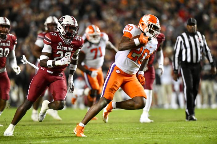 Kobe Pace (20) runs past the South Carolina defense for a 34-yard touchdown in the second quarter of the rival football game on Saturday night.