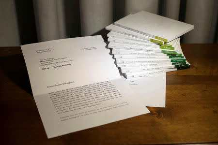 FILE PHOTO: A series of 11 booklets on The Theology of Pope Francis and a letter from former Pope Benedict, which was read out at the presentation of the work, are seen at the Vatican in this undated handout photo obtained by Reuters March 15, 2018. Osservatore Romano/Handout via Reuters/File photo