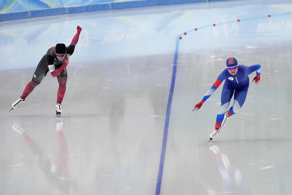 Natalia Voronina of the Russian Olympic Committee, right, competes against Valerie Maltais of Canada during the women's speedskating 3,000-meter race at the 2022 Winter Olympics, Saturday, Feb. 5, 2022, in Beijing. (AP Photo/Sue Ogrocki)