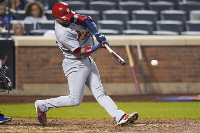 Cards hold off Mets 7-6 in 11 to move into playoff position