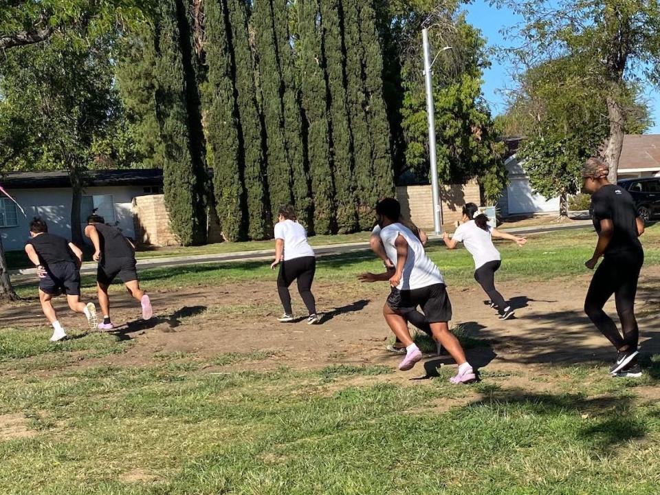 Players run across the field to the finish line before the music stops.