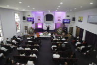 Pastor Elton Johnson, top center, conducts a funeral service in memory of Lydia Nunez, who died from COVID-19, at the Metropolitan Baptist Church Tuesday, July 21, 2020, in Los Angeles. (AP Photo/Marcio Jose Sanchez)