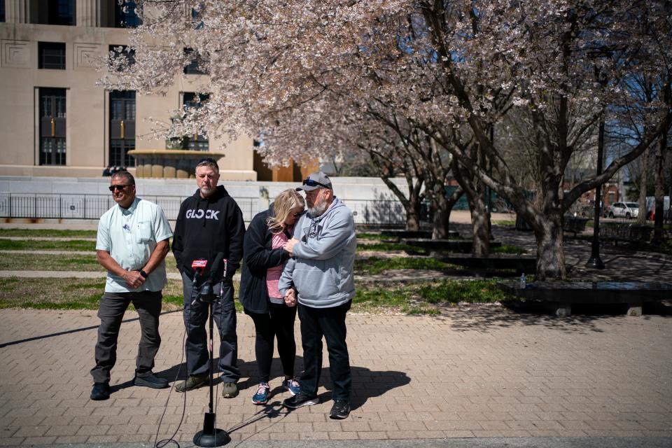 Michelle Strain Whiteid, second right, and her husband, Chris Whiteid, right, speak to the media during a press conference to update the public about the disappearance of University of Missouri student Riley Strain at Public Square Park in Nashville, Tenn., Tuesday, March 19, 2024. Also pictured are David Flagg, United Cajun Navy, left, and Riley's dad, Ryan Gilbert.