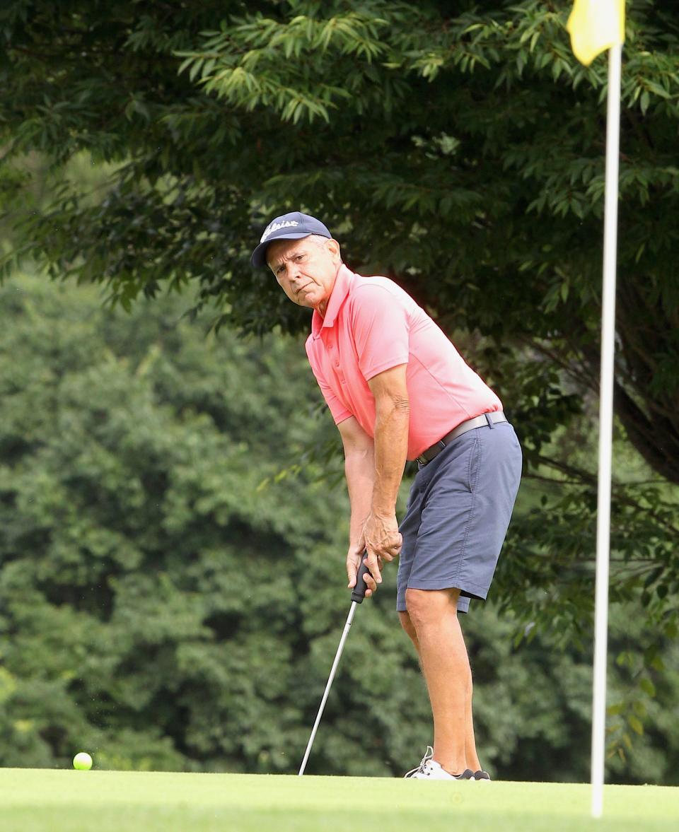 Dan Neubecker drops a putt on the first green during the City Golf Qualifying Tournament at Cascades Golf Course 
 on Sunday, June 26, 2022. Neubecker won the Super Senior title by four shots.
