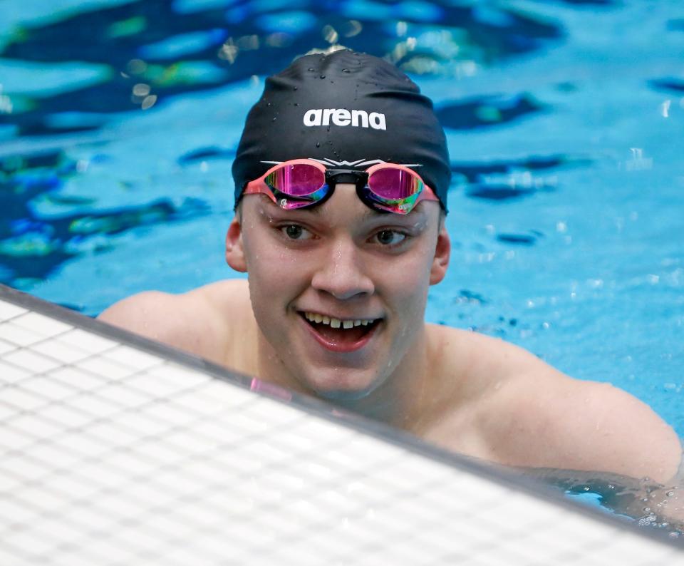 South Bend Riley senior Chris Bartmess smiles after winning the 100-yard breaststroke state championship race the IHSAA boys swimming state finals Saturday, Feb. 24, 2024, at the IU Natatorium in Indianapolis.