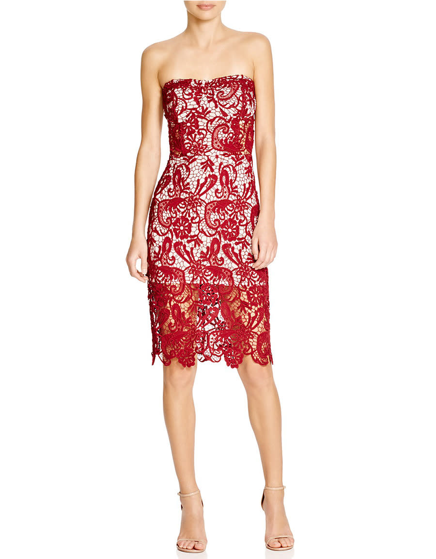 This festive red lace dress makes a major impact at any party.