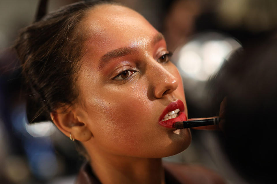 <p>Dewy skin, bare eyes, brushed-up brows, and an overall flush pair perfectly with the vermilion red lip at Bibhu Mohapatra. (Photo: Getty Images) </p>